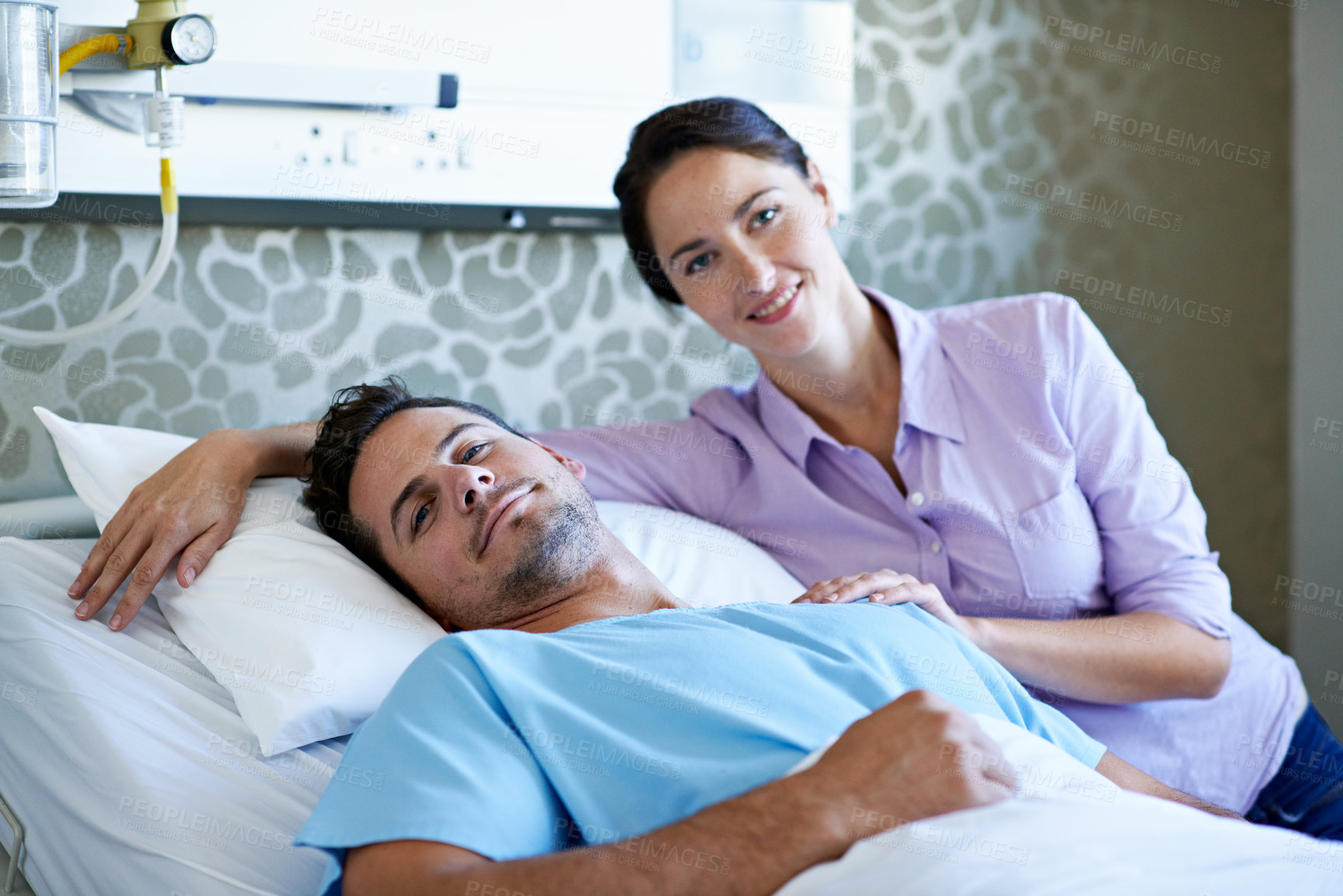Buy stock photo Portrait, woman and man in bed at hospital, support and treatment for medical recovery. Smile, couple or visit patient in icu ward with comfort, post surgery and rehabilitation for healthcare service