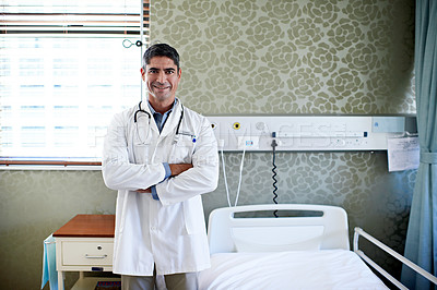 Buy stock photo Portrait of a doctor standing in a hospital bed
