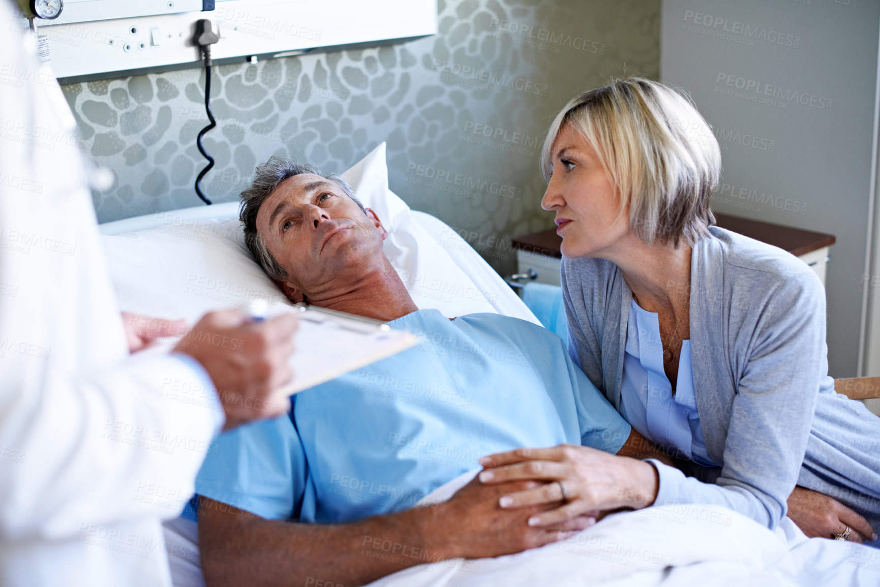 Buy stock photo Doctor, consulting and medical with couple in hospital for advice, treatment progress and help. Healthcare exam, surgery schedule and update with people in clinic for support, discussion and recovery