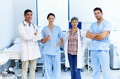 Buy stock photo Portrait of confident team of doctors standing in a hospital