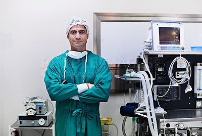 Buy stock photo Portrait of a confident surgeon standing in an operating room