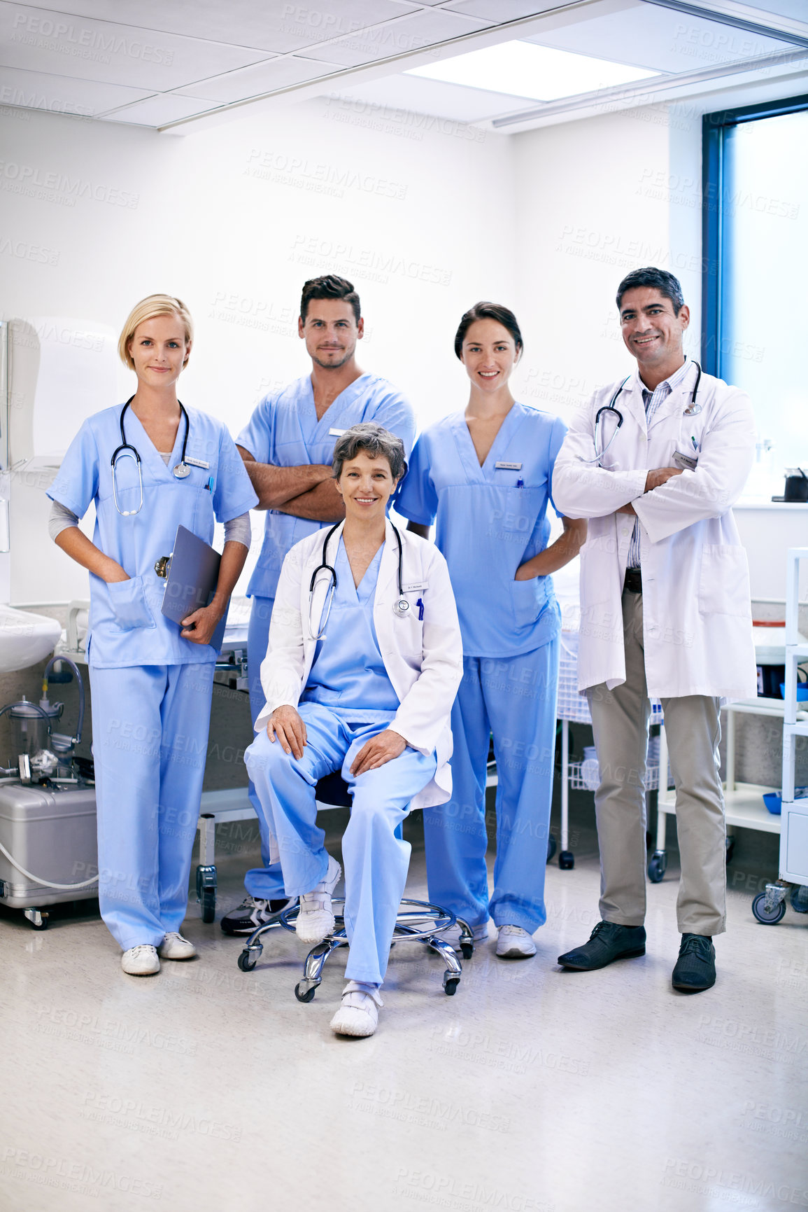 Buy stock photo Doctor, team and happy in hospital for healthcare service, patient care and resident in charge. Staff portrait, people and nurses with confidence in ward for health support, expertise or shift leader
