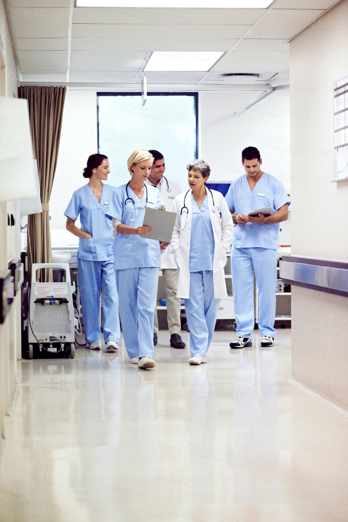 Buy stock photo Hospital, teamwork and doctors with clipboard, walking and discussion with patient report or talking. Clinic, medical professional and people with checklist, reading and treatment plan with info