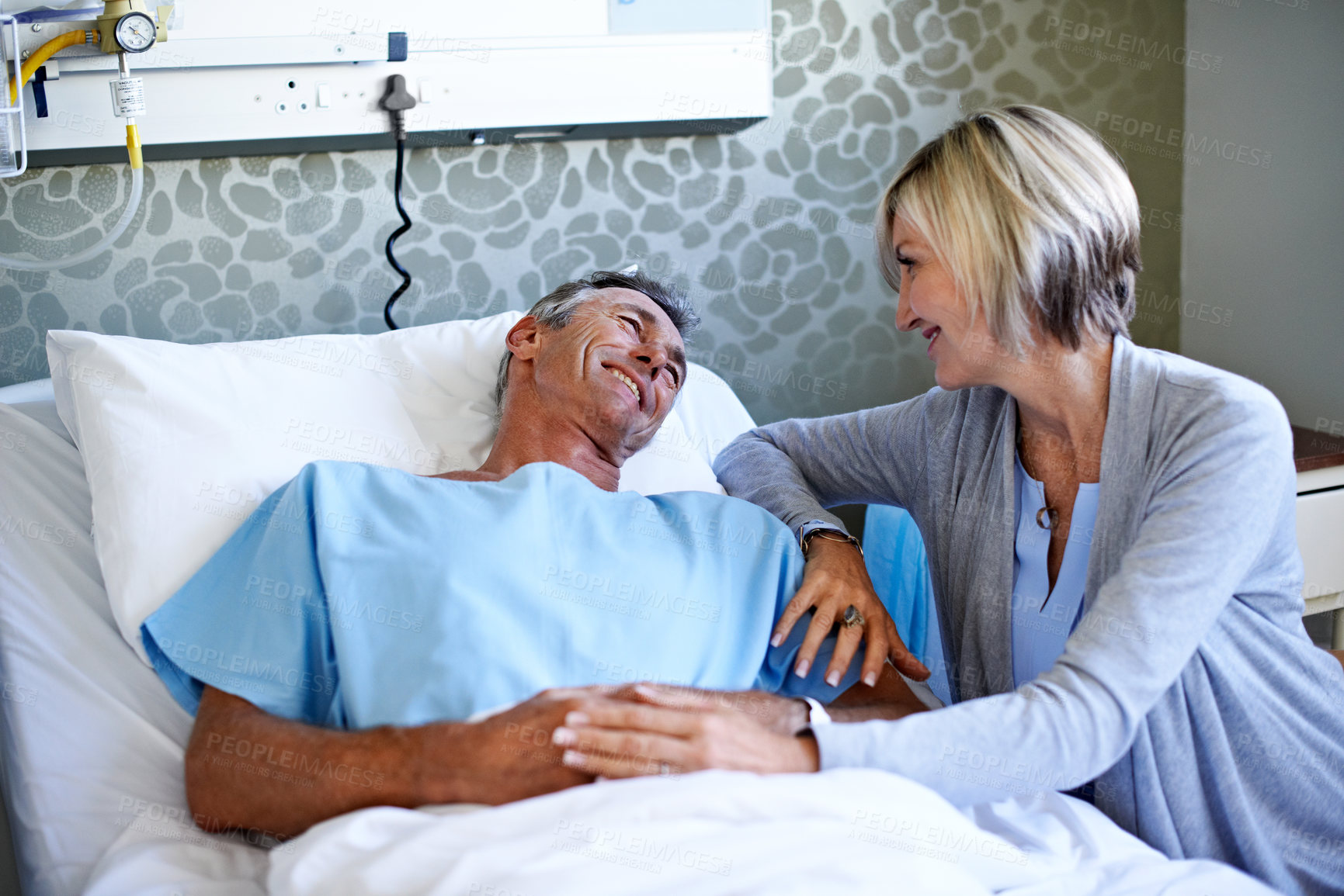 Buy stock photo Support, smile and love with couple in hospital for medical recovery, connection or visit. Healthcare treatment, icu healing and patient care with mature man and woman in clinic for trust and empathy