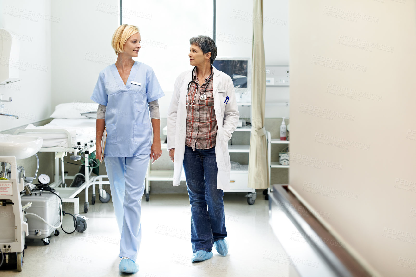 Buy stock photo Team, doctor and talking with nurse in hospital for medical advice, consulting and support. Update, collaboration and healthcare with women walking in clinic for feedback, mentor and physician