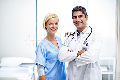 Buy stock photo Portrait of two medical professionals standing in a hospital ward