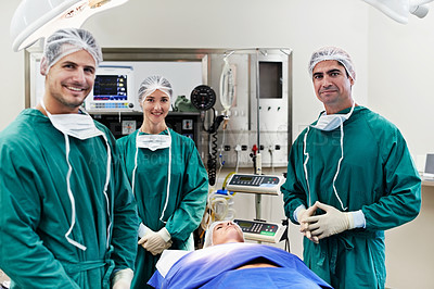 Buy stock photo Portrait of surgeons working on a patient in an operating room