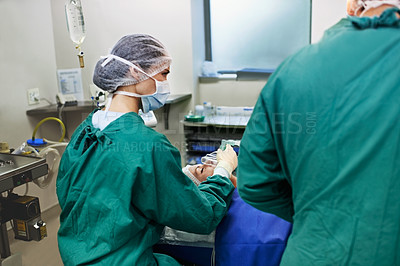 Buy stock photo Portrait of surgeons working on a patient in an operating room