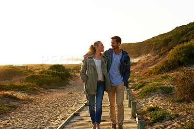 Buy stock photo Shot of an adventurous couple spending time in the outdoors