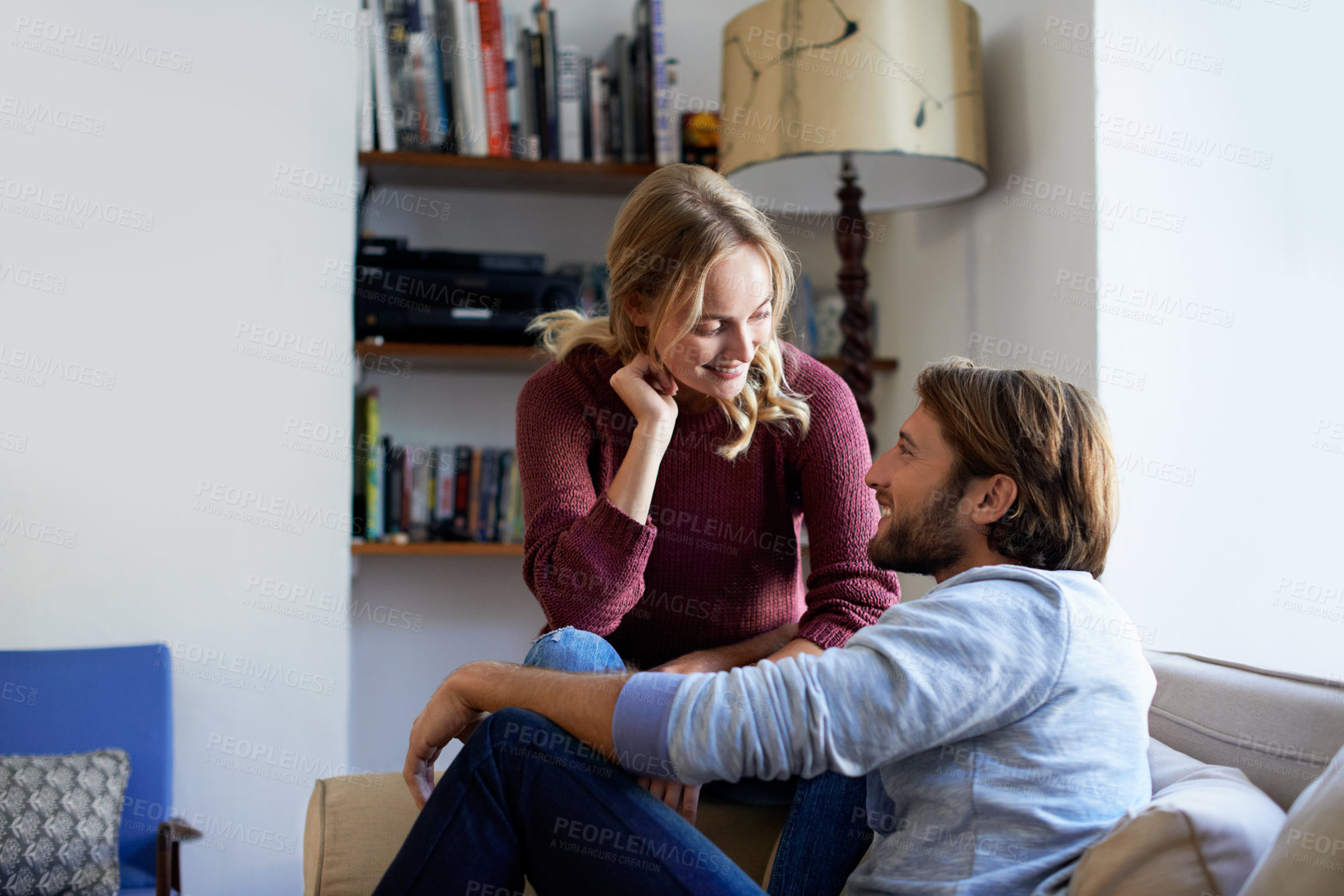 Buy stock photo Happy, couple and relax on couch in house, love and bonding with partner in living room and romance. People, smile and connection with spouse in lounge, break and relationship commitment in home