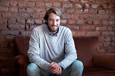 Buy stock photo Portrait of a young man sitting on a couch