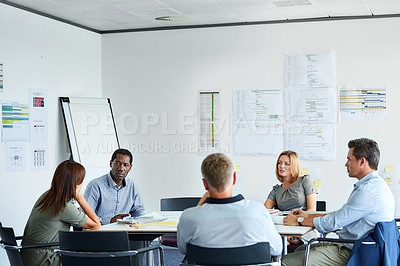 Buy stock photo Shot of a group of coworkers having a meeting in an office