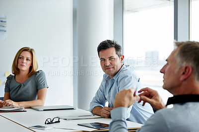 Buy stock photo Shot of a group of coworkers having a meeting in an office