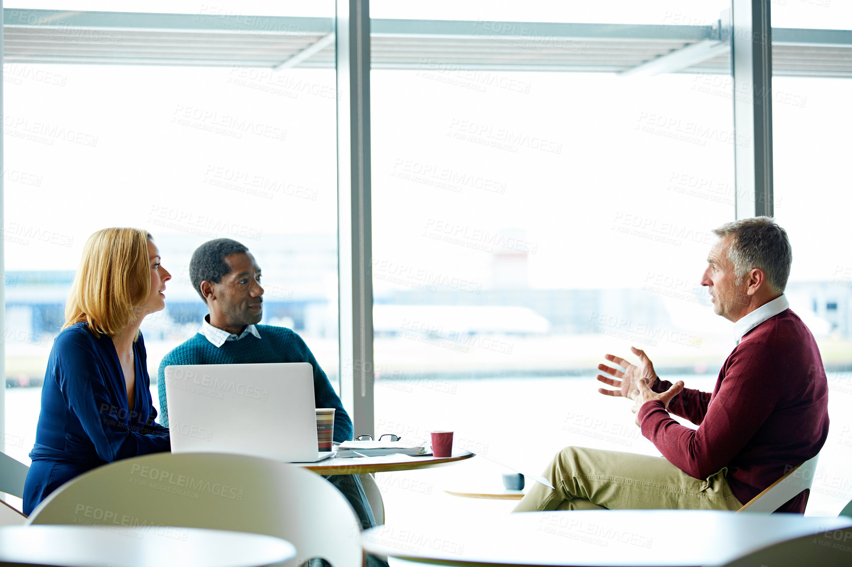 Buy stock photo Shot of a group of coworkers having a meeting in an office