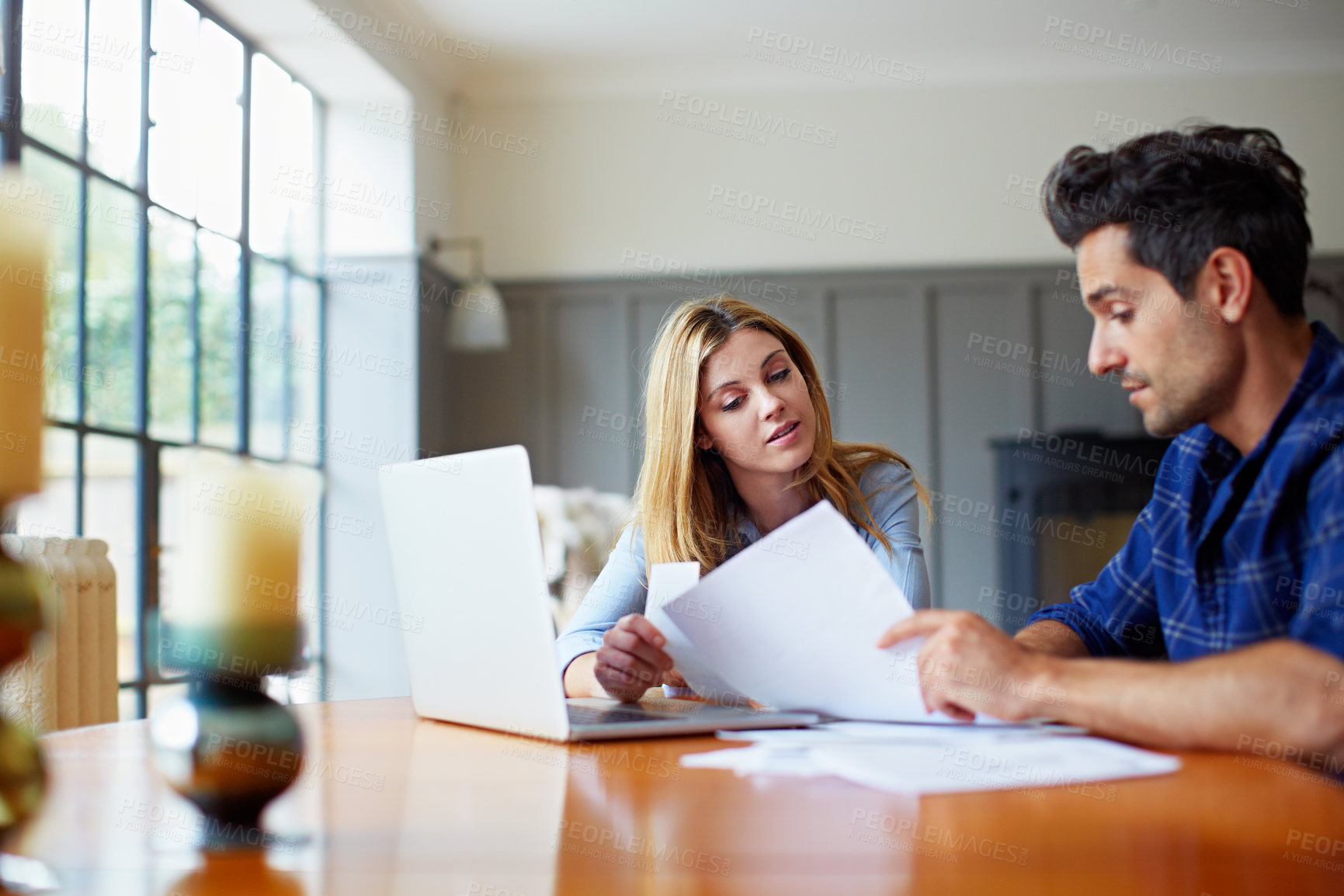 Buy stock photo Paperwork, laptop and couple in home for budget discussion, tax bills or insurance cost with receipt. Computer, man and woman with document for expenses, review debt and account statement in house
