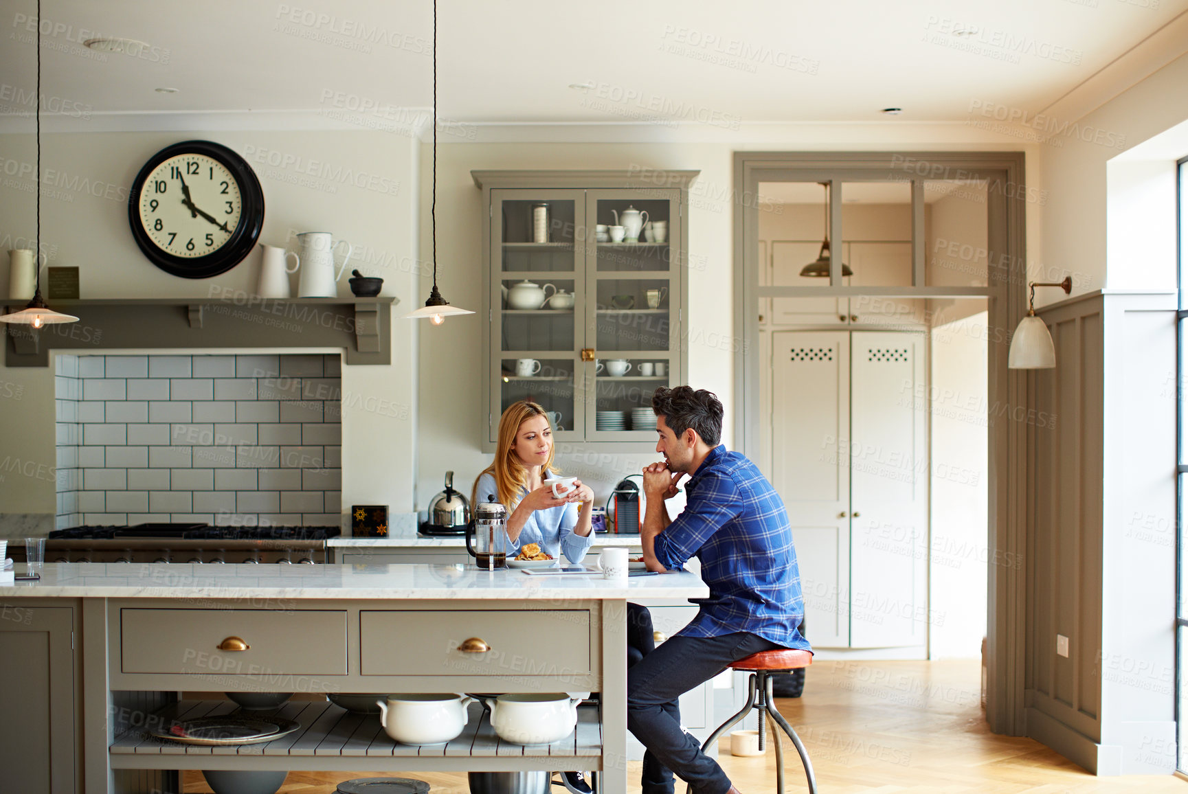Buy stock photo Relax, couple and talk with coffee in kitchen for gossip, bonding together and morning routine. Happy people, discussion and caffeine drink for weekend break, marriage commitment and love in house
