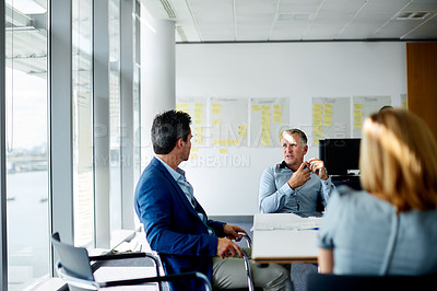Buy stock photo Shot of a group of coworkers having a meeting in an office