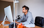 Down to business in his home office