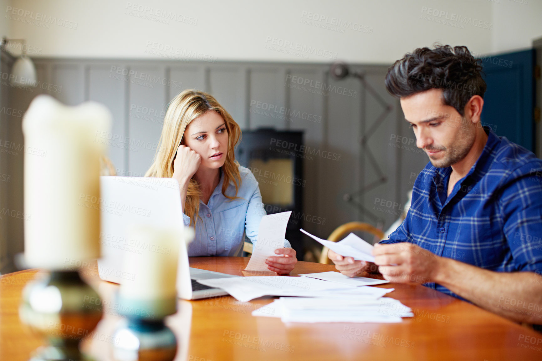 Buy stock photo Paperwork, stress and couple in home with debt, reading tax bills and insurance cost with fees. Concern, man and woman with document for expenses, planning and check account statement in house