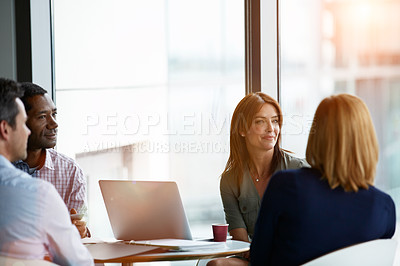Buy stock photo Shot of a group of coworkers having a meeting in an office