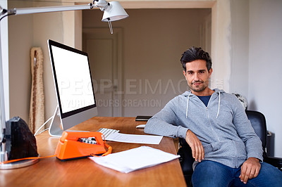 Buy stock photo Portrait of a handsome young man working from his home office