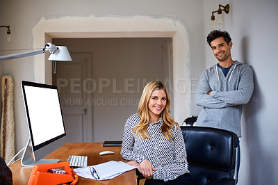 Buy stock photo Portrait of a young couple working together in their home office