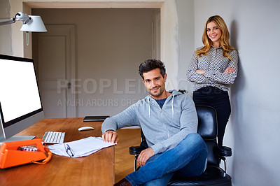 Buy stock photo Portrait of a young couple working together in their home office