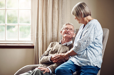 Buy stock photo Shot of a senior couple sharing an affectionate moment at home