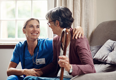 Buy stock photo Shot of a senior woman being cared for by a young nurse at home