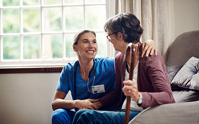 Buy stock photo Shot of a senior woman being cared for by a young nurse at home
