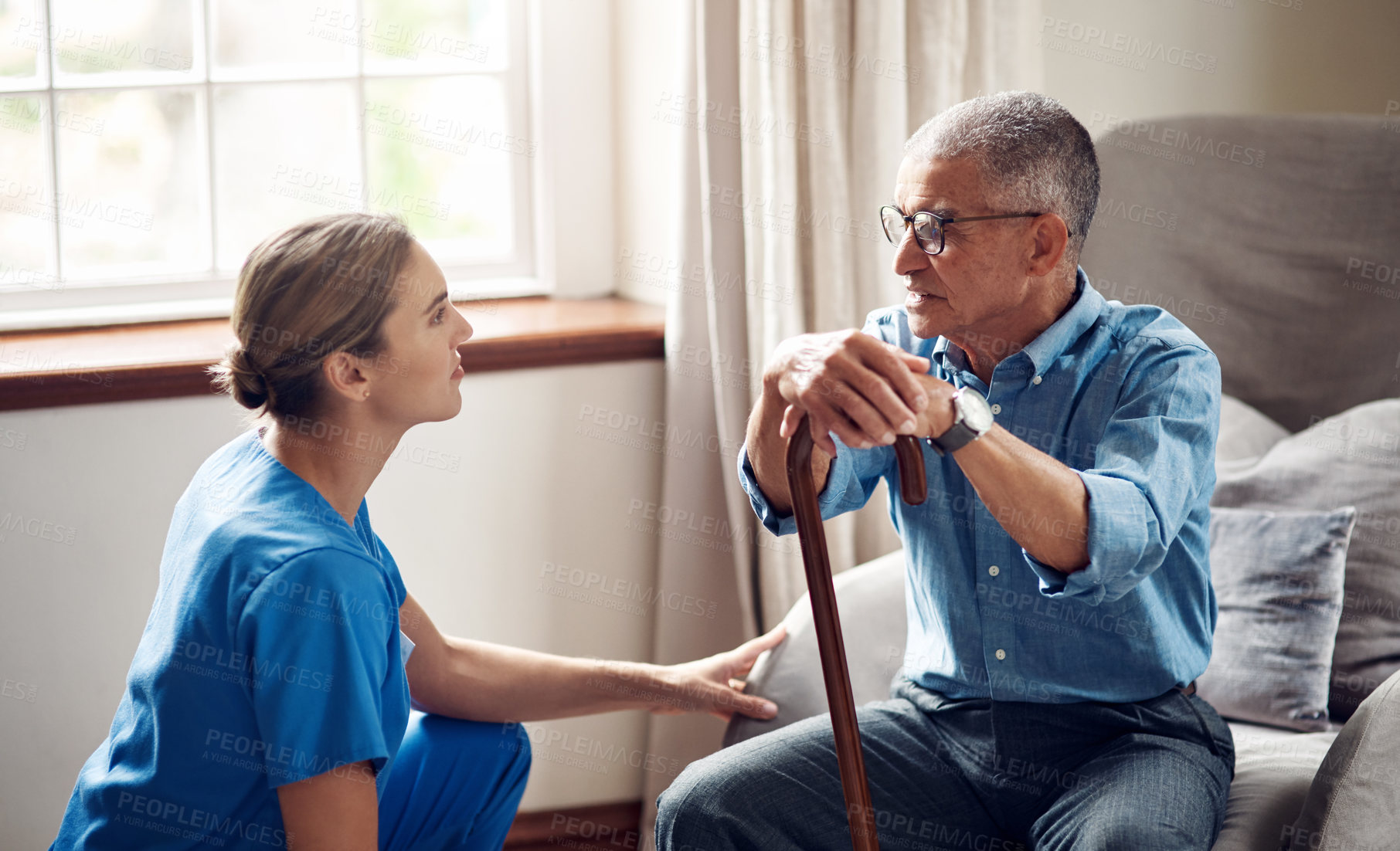 Buy stock photo Caregiver, checkup and old man at house with walking stick, support and assistance for recovery. Smile, nurse and senior person with disability, assisted living and friendly advice for physiotherapy