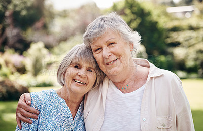 Buy stock photo Cropped portrait of two senior women holding each other during a day out in the garden