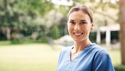 Buy stock photo Portrait of a confident young nurse standing outside in the garden of a retirement home
