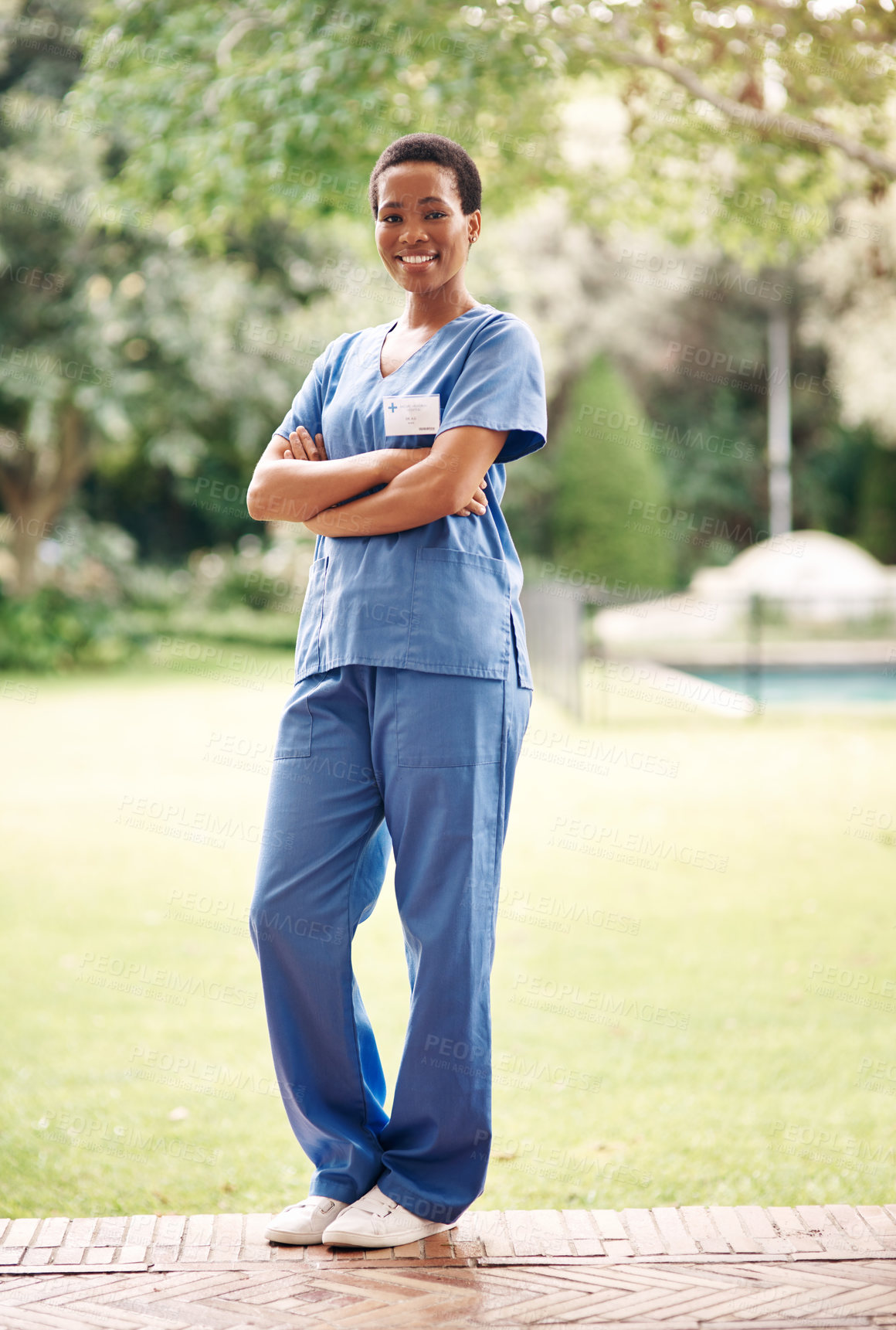 Buy stock photo Portrait, caregiver or black woman with pride for medical aid, assisted living or health service. Female person, healthcare worker or happy nurse with confidence or arms crossed in outdoor garden
