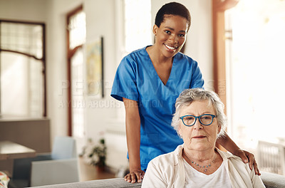 Buy stock photo Shot of a senior woman being cared for by a young nurse at home