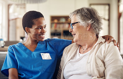 Buy stock photo Shot of a senior woman being cared for by a young nurse at home