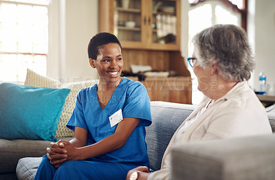 Buy stock photo Shot of a senior woman being cared for by a young nurse at home