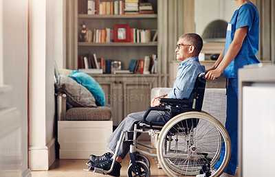 Buy stock photo Shot of a senior man in a wheelchair being cared for by a nurse at home