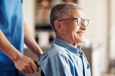 Buy stock photo Shot of a senior man in a wheelchair being cared for by a nurse at home