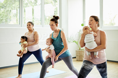 Buy stock photo Cropped shot of a group of mothers holding their babies during a baby yoga class indoors