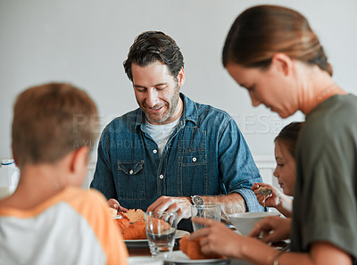 Buy stock photo Shot of a family of four having breakfast together at home