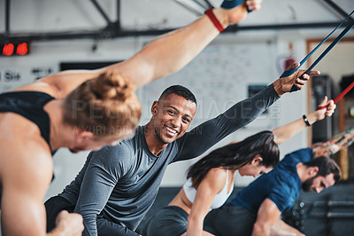 Buy stock photo Cropped shot of a group of young athletes in an exercise class at the gym