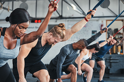 Buy stock photo Cropped shot of a group of young athletes in an exercise class at the gym
