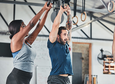 Buy stock photo Cropped shot of a group of young athletes in an exercise class at the gym