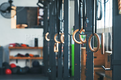 Buy stock photo Shot of gymnastic rings and other gym equipment