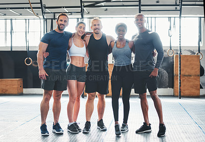 Buy stock photo Portrait of a group of young athletes standing together in the gym