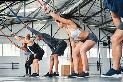 Buy stock photo Cropped shot of a group of young athletes in an exercise class at the gym