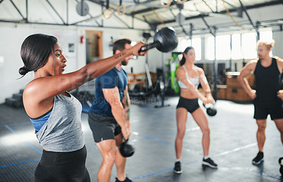 Buy stock photo Cropped shot of a group of young athletes in an exercise class at the gym