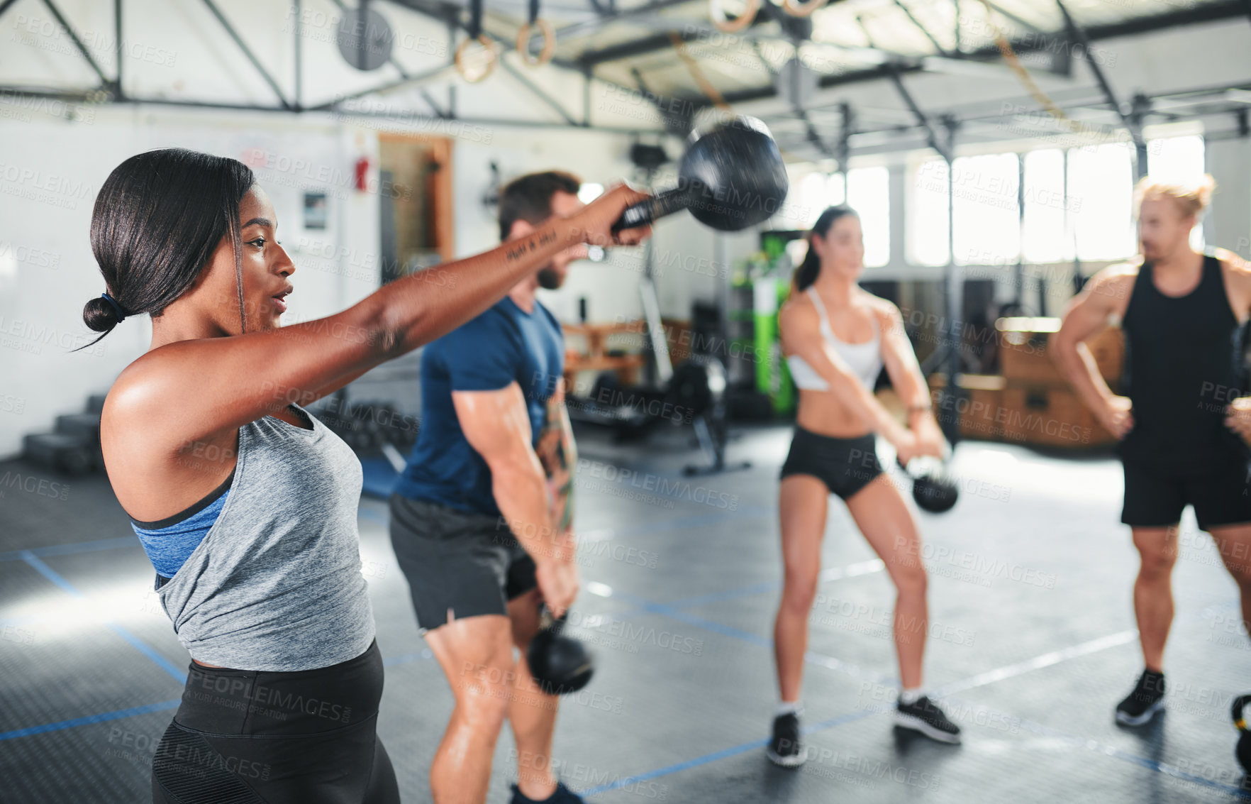 Buy stock photo Cropped shot of a group of young athletes in an exercise class at the gym