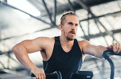 Buy stock photo Shot of a man doing cardio at the gym
